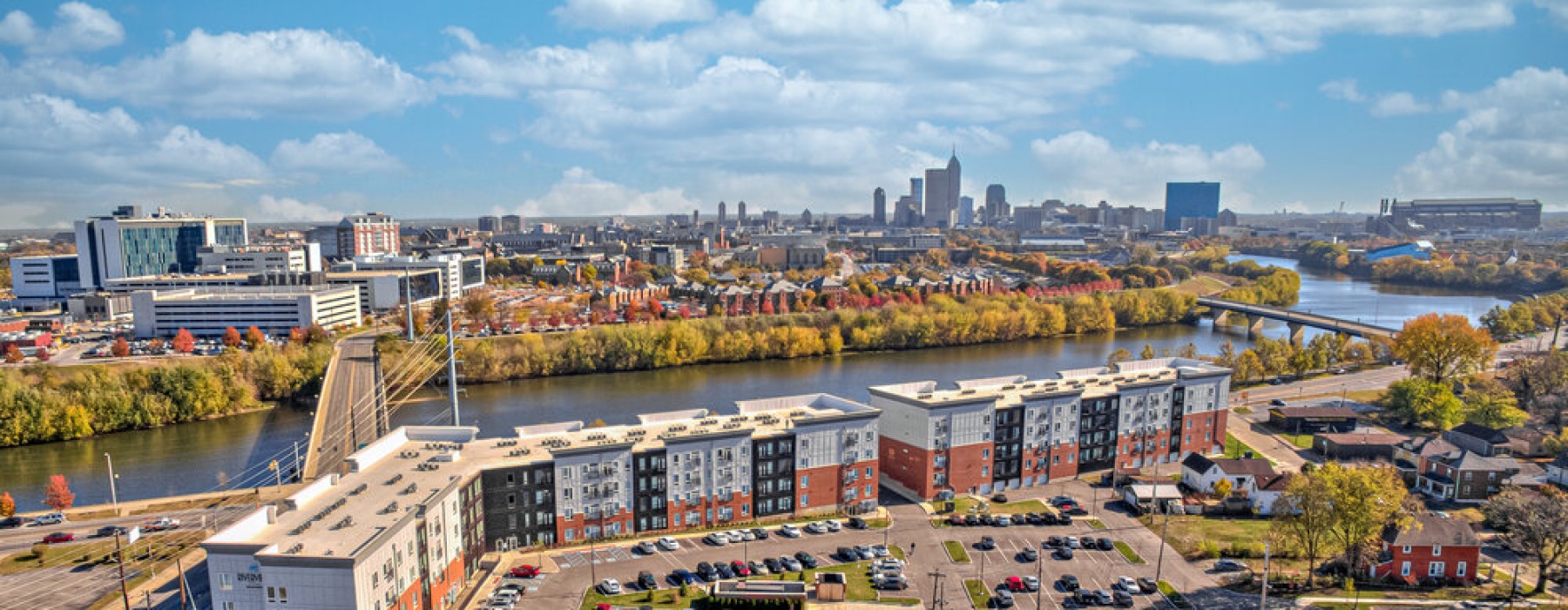 Aerial photo of apartment building with Downtown Indianapolis in the background